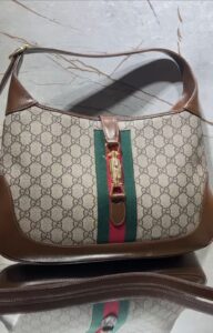 Bolsa Gucci Jackie 1961 Monogram - Bege/Marrom