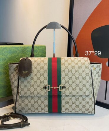 Bolsa Gucci Grande Paparazzo Monograma